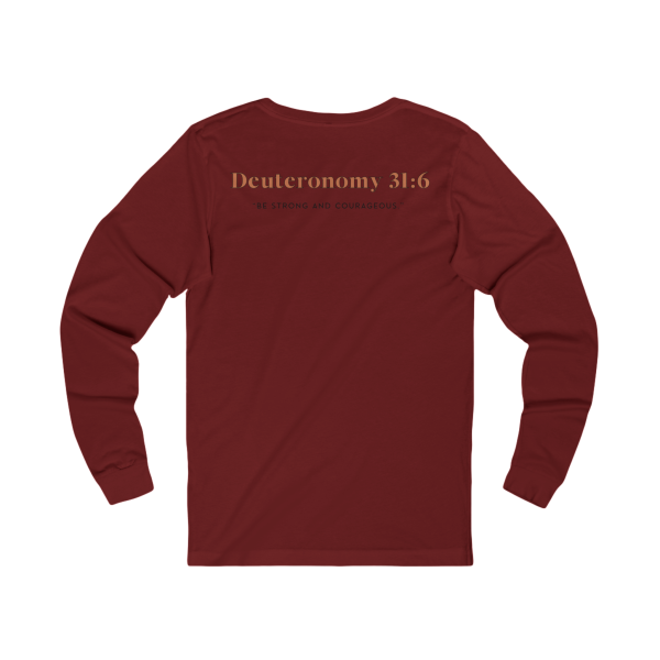 Cardinal red Christian long sleeve shirt featuring a Spartan warrior weightlifting graphic with Pray Eat Lift slogan and Kingdom Mindset Warrior Grind message.
