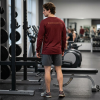 Cardinal red Christian long sleeve shirt featuring a Spartan warrior weightlifting graphic with Pray Eat Lift slogan and Kingdom Mindset Warrior Grind message.