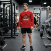 Red Christian fitness long sleeve shirt featuring a Spartan warrior lifting weights with Pray Eat Lift graphic and Kingdom Mindset Warrior Grind slogan.