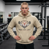 Sand-colored Christian fitness hoodie featuring a Spartan warrior lifting a barbell with the bold slogan "Pray Eat Lift" for faith-driven athletes and gym enthusiasts.